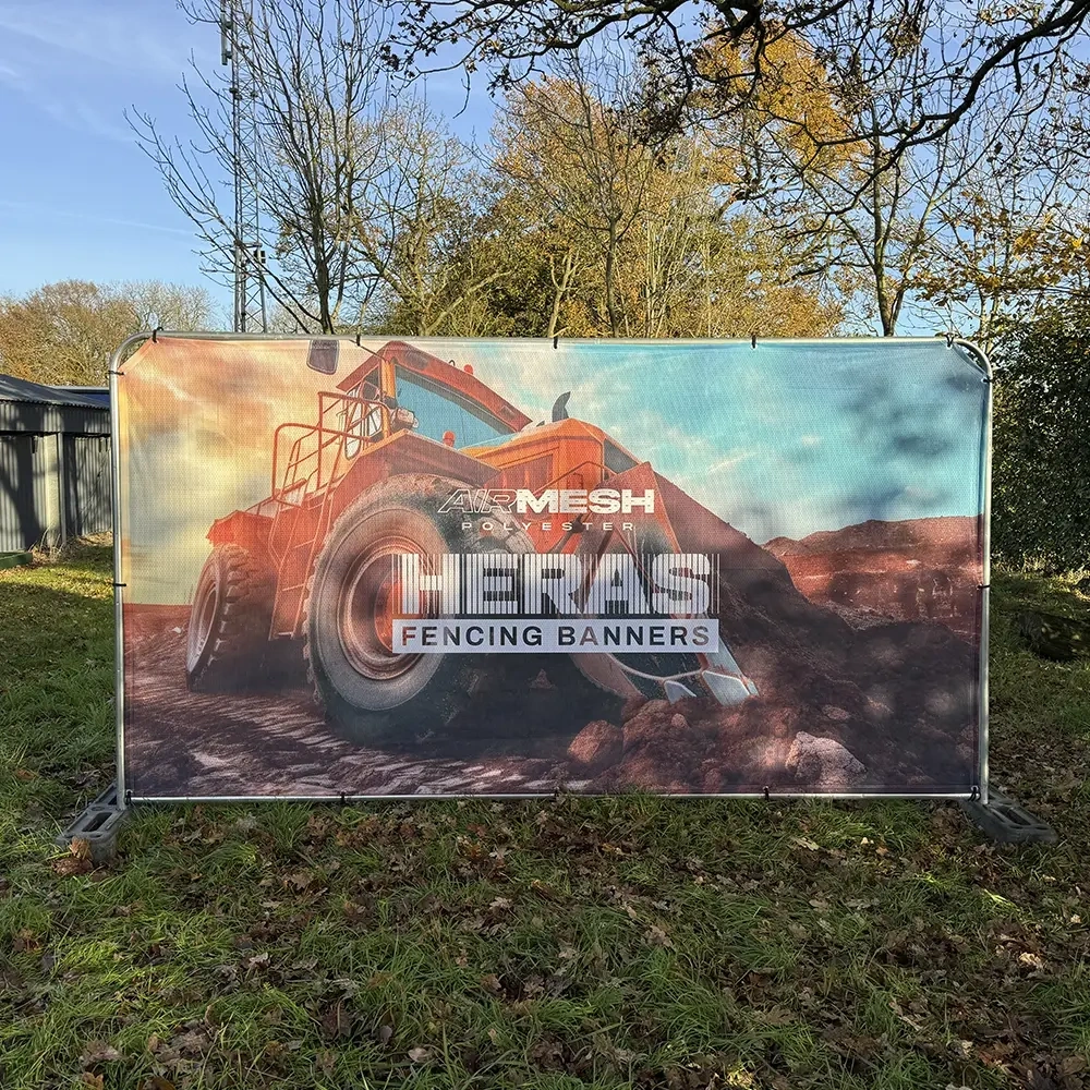 Printed Heras fencing banners on a site fence