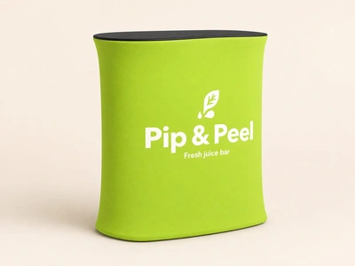 Lime green stretch fabric counter for Pip & Peel juice bar against a plain backdrop