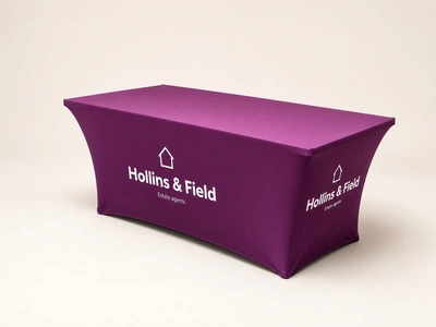 Purple stretch fabric tablecloth for Hollins & Field estate agents against a plain backdrop