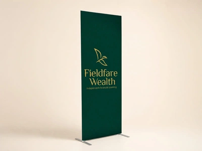 Green stretch economy banner for Fieldfare Wealth standing against a plain backdrop