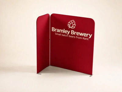 Red folding fabric exhibition display for Bramley Brewery on a plain studio backdrop