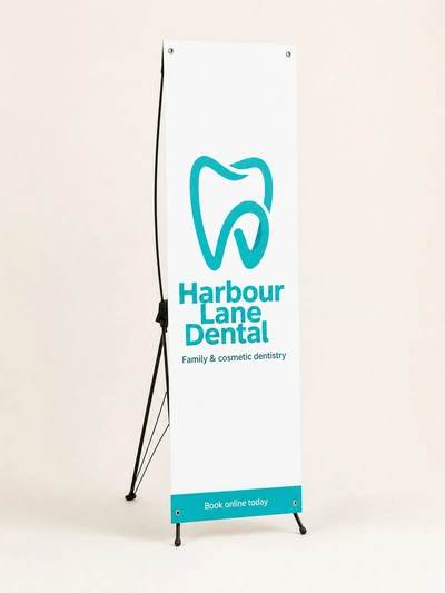 Xscape banner stand for Harbour Lane Dental family dentistry standing against a plain backdrop
