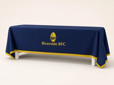 Navy tablecloth with gold trim for Riverside RFC draped over a table against a plain backdrop