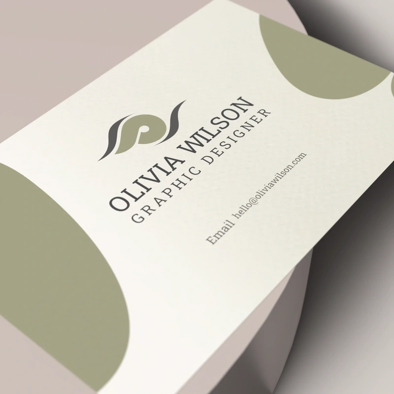 A designed business card with a leaf logo